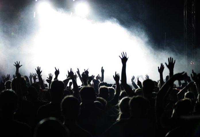 Crowd,Raising,Hands,At,A,Pop,Concert;,White,And,Grey-blue