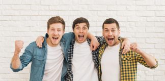 https://image.freepik.com/free-photo/excited-young-male-friends-standing-against-white-wall-clenching-their-fist_23-2148160169.jpg