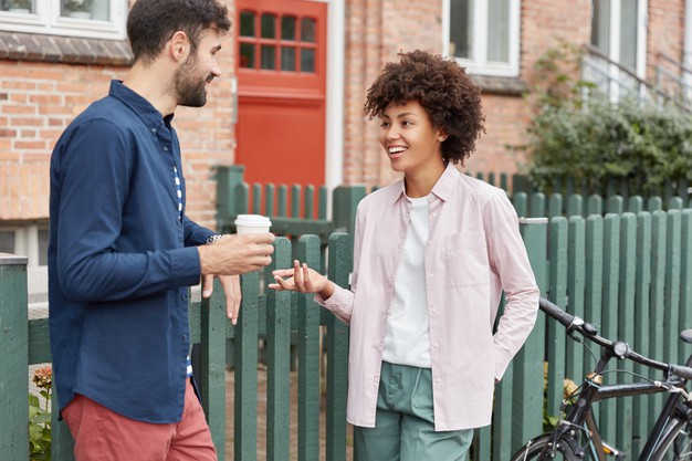 https://image.freepik.com/free-photo/positive-multiracial-couple-walk-rural-setting-stroll-during-weekends-drink-takeaway-coffee-stand-near-fence-have-pleasant-talk-with-each-other_273609-18702.jpg