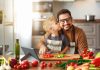 Happy,Family,Father,With,Son,Preparing,Vegetable,Salad,At,Home