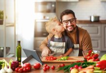 Happy,Family,Father,With,Son,Preparing,Vegetable,Salad,At,Home
