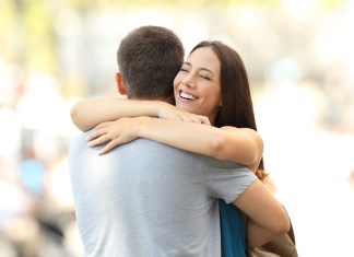 Happy girlfriend hugging her partner after encounter