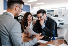 Worried,Middle,Age,Man,With,His,Wife,Buying,Car,In