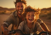 Parents and children, father with son. Happy family, a carefree and playful bicycle ride. people playing and laughing outdoors. Happiness and love in a fun relationship between dad and kid.